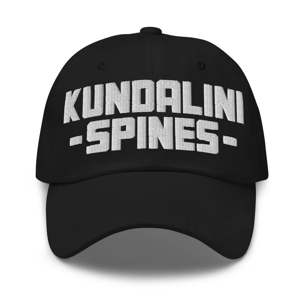 Black unstructured dad hat with KUNDALINI SPINES embroidered across the front in raised white block letters.